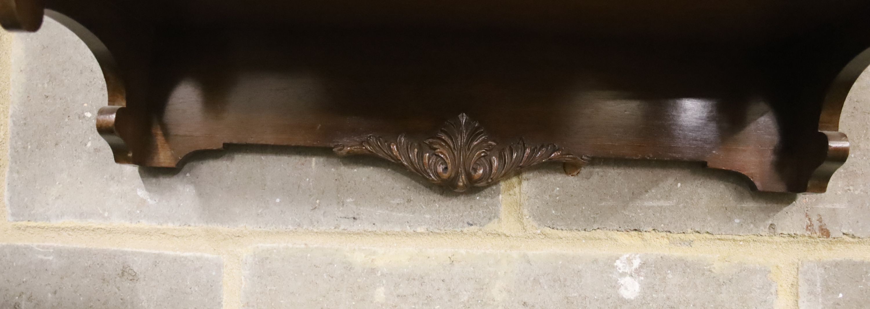 A mahogany three shelf wall bracket, width 57cm, depth 23cm, height 94cm